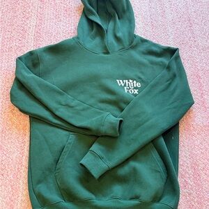 whire fox hoodie with words on back